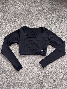 Varsity Black Long-Sleeve Cropped Athletic Top. Scoop neck liner. SSMSC15